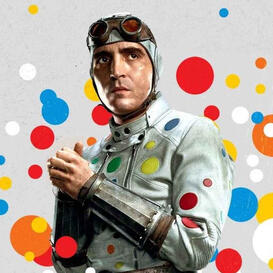 A man in a white jumpsuit with colored polkadots on it wearing red goggles