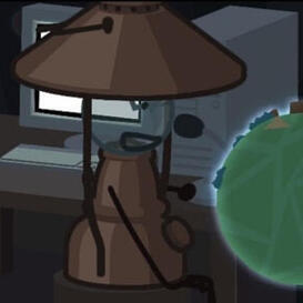 A bronze anthropomorphic trawler lantern sitting at a computer and smiling